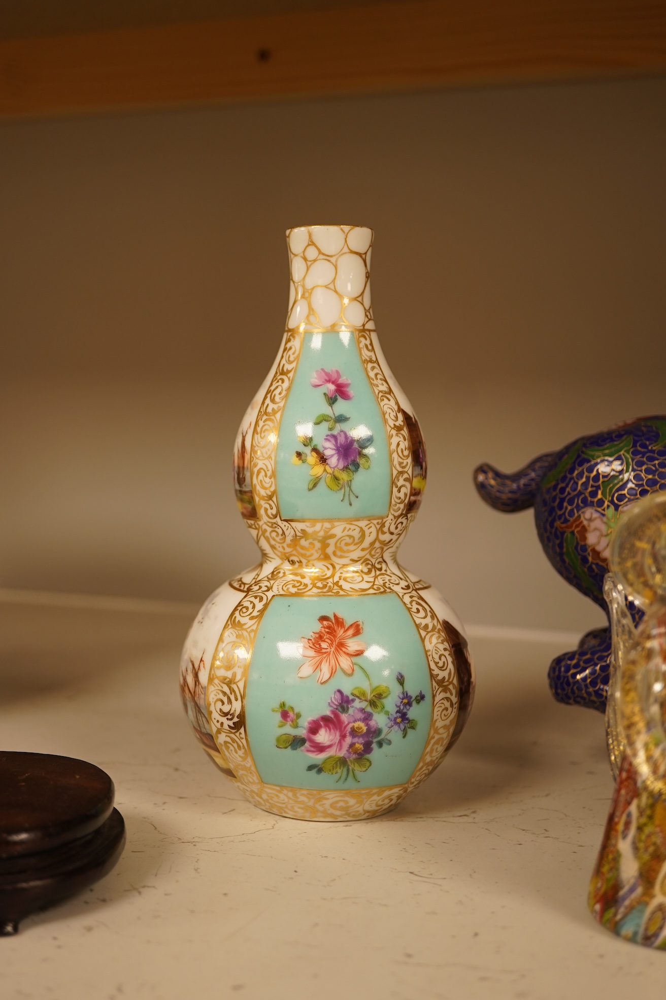 A Chinese cloisonné enamel horse and vase, two miniature Rockingham floral teapots, a malachite box etc (9). Cloisonné horse 20cm long.